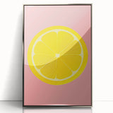 Mid-century modernist art featuring assorted fruits in vibrant colors on a silver-framed acrylic print.