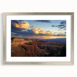 Framed landscape artwork showcasing a breathtaking canyon scene with vibrant colors and intricate details, featuring a sleek silver frame and a white mat for an elegant presentation. Perfect for adding a touch of nature-inspired decor to any space.