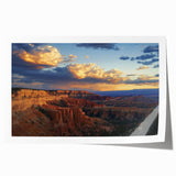 Vibrant rolled print showcasing a stunning landscape of canyons under a clear blue sky, perfect for home decor, framed art displays, or nature enthusiasts. The detailed textures and colors emphasize the natural beauty of the scene, making it an ideal choice for those looking to enhance their living spaces with breathtaking art.