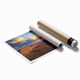 Vibrant landscape print showcasing dramatic canyons in rich earth tones, rolled up for easy transport and display, perfect for home or office decor.