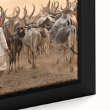 Close-up of a textured black wall art depicting a vibrant, colorful Indian scenery on a framed canvas.