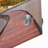 Large abstract wall art featuring a European scenery in muted earth tones on acrylic glass.