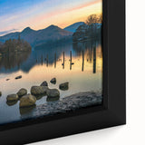 Close-up of black wall art featuring textured, colorful European scenery on framed canvas, ideal for living room decor.