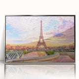 Large art print of a Parisian street scene in muted gray and blue tones on a silver-framed acrylic.