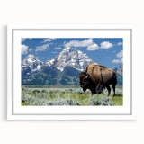 Abstract art print of the Grand Tetons in muted earth tones on a framed white mat, suitable for bedroom or dining room decor.