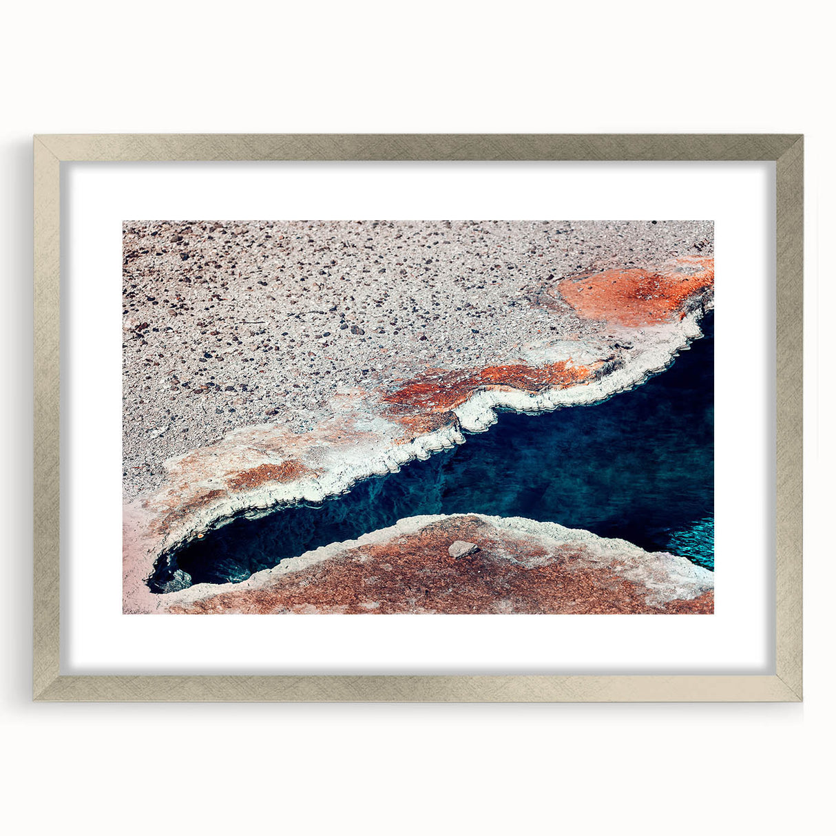 Textured art depicting abstract Yellowstone scenery in muted earth tones on a framed silver mat, ideal for bedroom art.
