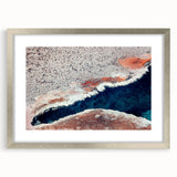 Textured art depicting abstract Yellowstone scenery in muted earth tones on a framed silver mat, ideal for bedroom art.