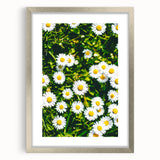 Textured abstract art print in muted green and blue tones, framed in silver, ideal for bedroom wall decor.