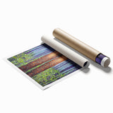 Abstract floral artwork print with vibrant colors and intricate patterns, rolled and ready for framing, displayed in a protective cardboard tube. Perfect for modern home decor.