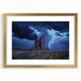 Gold-framed landscape print showcasing a majestic castle surrounded by lush greenery, elegantly matted for a refined presentation, perfect for home decor.