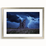 Framed landscape artwork showcasing a serene castle scene, surrounded by a silver mat finish, ideal for elegant home decor or office styling.
