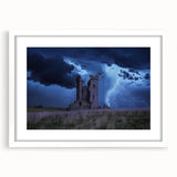 Framed landscape artwork featuring a majestic castle surrounded by lush greenery, presented with a white mat, ideal for home decor and wall art enthusiasts.