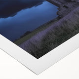 Rolled canvas print showcasing a picturesque landscape of a majestic castle set against a vibrant sunset, featuring rich colors and intricate details, ideal for home decor.