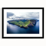 Black-framed landscape artwork showcasing dramatic cliffs against a vibrant sunset, elegantly matted to enhance the visual impact, perfect for modern home decor.