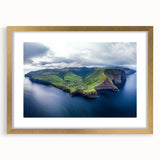 Framed landscape artwork depicting rugged cliffs with a gold mat border, showcasing vibrant colors and textures, perfect for enhancing home decor elegance.
