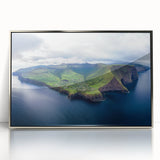 Framed acrylic artwork showcasing a stunning landscape of dramatic cliffs under a sunset, featuring vibrant colors and intricate details, perfect for home decor.