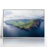 Framed acrylic artwork showcasing a stunning landscape of cliffs in vibrant colors, set against a sleek white frame, perfect for enhancing modern decor.