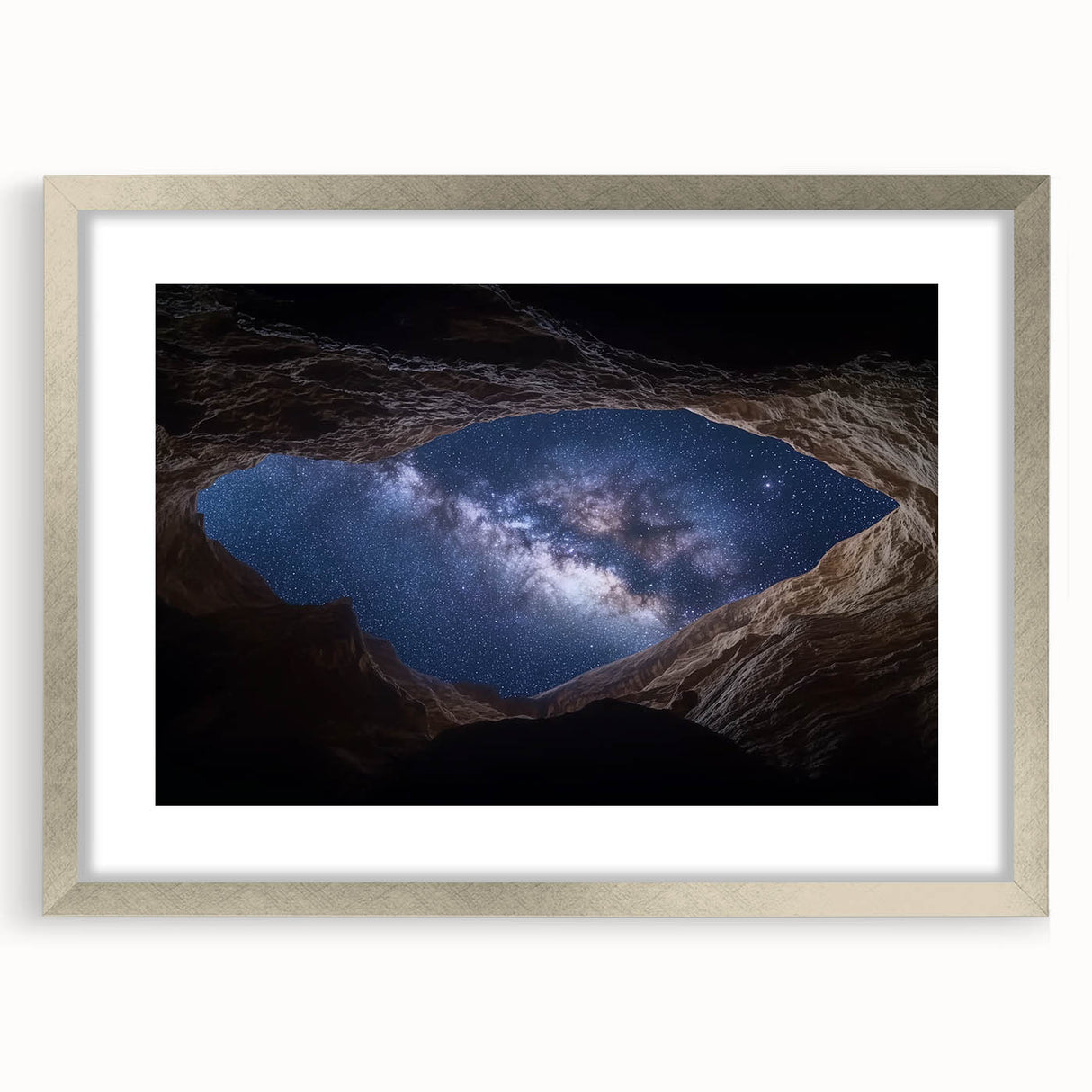 Framed landscape artwork depicting majestic canyons in vibrant colors, featuring a sleek silver frame and white matting, ideal for home decor enhancement.