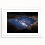 Landscape print of canyons framed with a white mat, showcasing vibrant earth tones and dramatic rock formations, perfect for enhancing modern home decor.