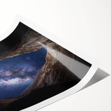 Landscape canyon rolled print showcasing vibrant hues of orange and blue, capturing dramatic rock formations under a clear sky, perfect for home decor.