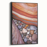 Framed canvas artwork showcasing a stunning desert landscape in warm tones, featuring a sleek black frame, ideal for home decor and art enthusiasts.