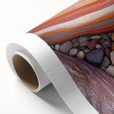 Desert landscape rolled canvas art depicting vibrant sand dunes and a clear blue sky, elegantly packaged in a protective cardboard tube for shipping.