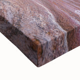 Close-up of a stretched canvas artwork showcasing a vibrant desert landscape, highlighting warm tones of orange and yellow, perfect for home decor or gallery displays.