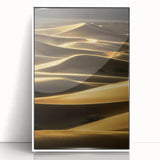 Framed acrylic artwork depicting serene desert dunes in soft beige and golden hues, highlighting the beauty of nature in a modern white frame, perfect for home decor.