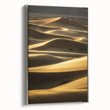 Framed canvas print depicting serene landscapes of sand dunes, featuring a silver frame that enhances the artwork's elegant design, ideal for modern home decor.