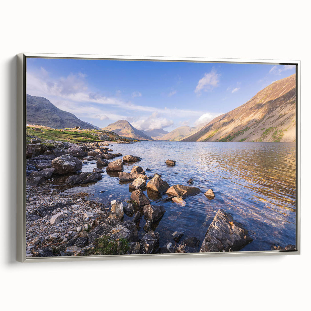 Landscape art painting of Cumbria, England featuring colorful hills and a lake, presented on a silver-framed canvas.