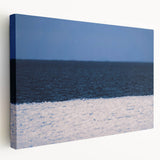 A panoramic view of a European cityscape in muted gray and blue tones on a large stretched canvas.