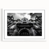 Textured art print of an abstract Rome cityscape in muted earth tones, framed in white, suitable for bedroom decor.