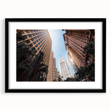 Extra large abstract art print of a vibrant, colorful South American scenery on a textured canvas, framed in black.