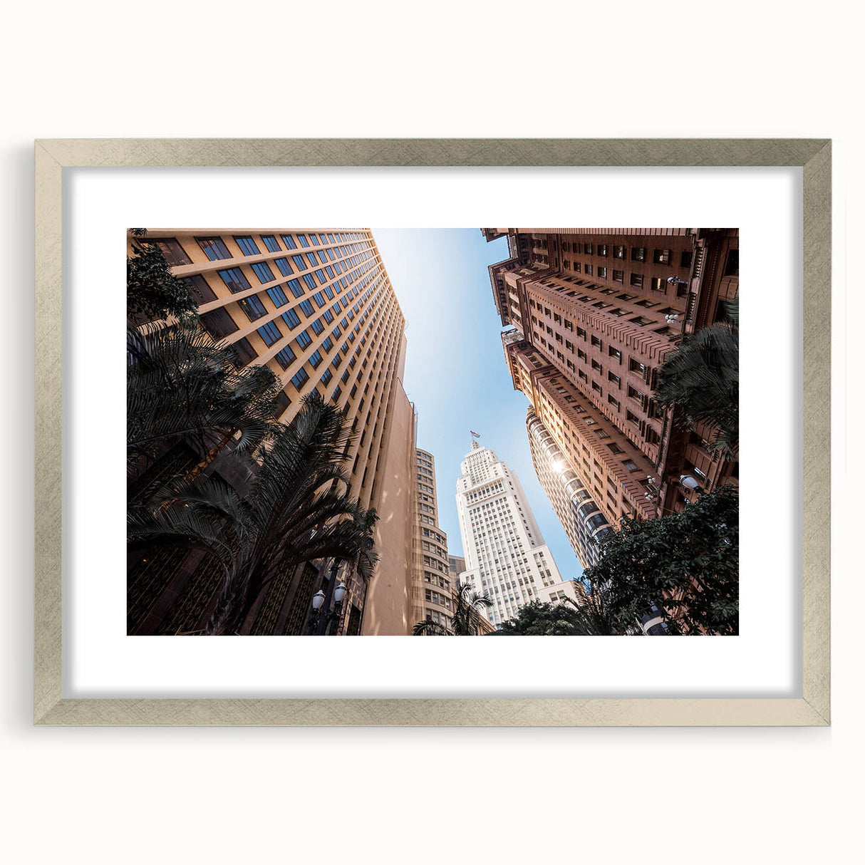 Abstract textured art print depicting a stylized Brazilian landscape in earth tones, framed in silver.