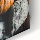 Large abstract wall art with warm autumnal hues on acrylic glass, suitable for dining room ambiance.