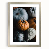 Textured abstract art print in warm orange and red tones on a framed canvas, ideal for bedroom wall decor.