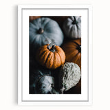 Abstract art print featuring swirling autumnal colors on a white framed canvas, suitable for bedroom or dining room decor.