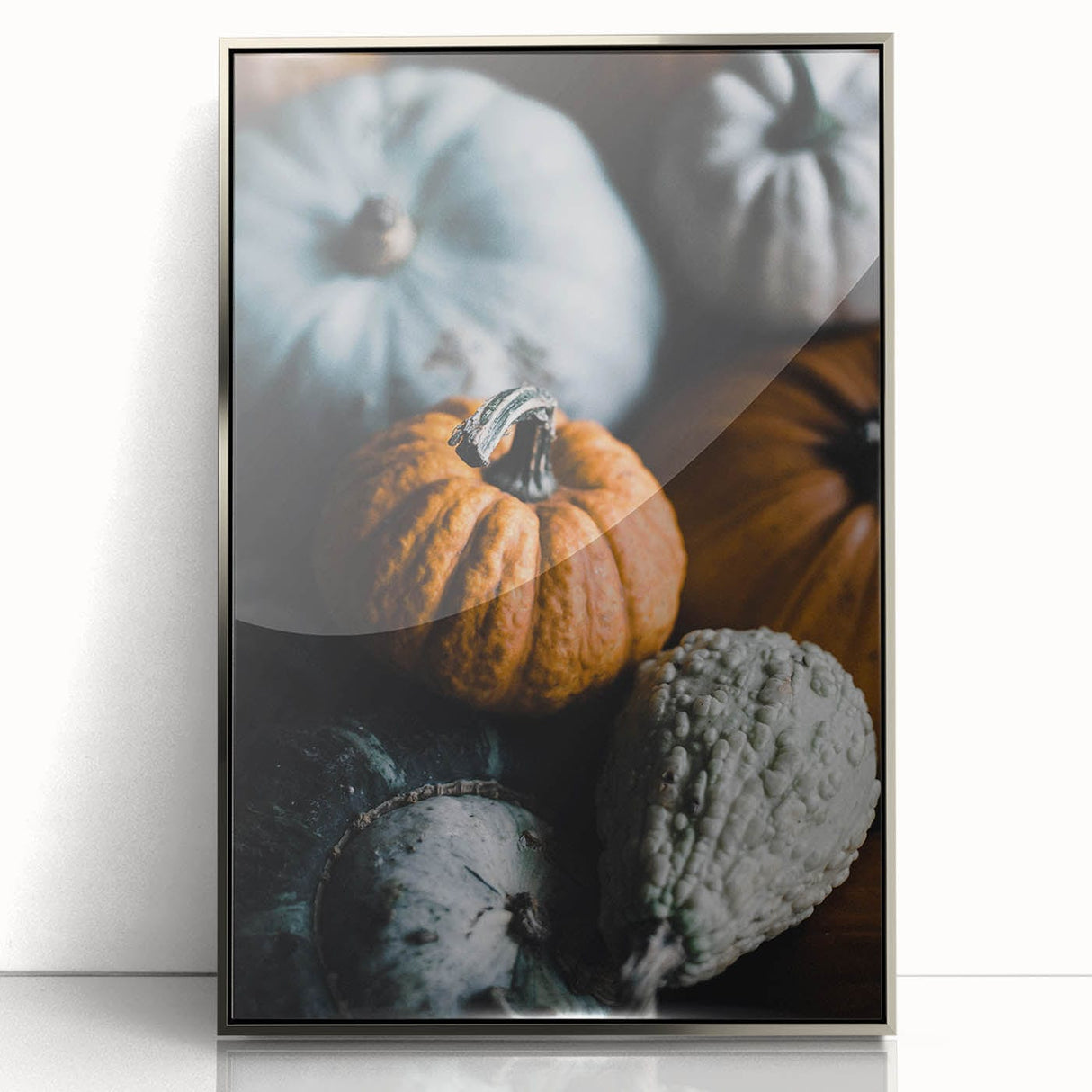 Mid-century modernist art featuring an abstract fall scene in warm orange tones on a framed acrylic print.
