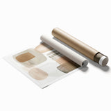 Abstract minimalist wall art print in soft pastel colors featuring geometric shapes and fluid lines, elegantly rolled for easy display and transport.