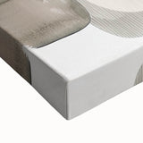 Close-up of a stretched canvas displaying abstract minimalist wall art in soft earth tones, showcasing smooth textures and subtle color gradients for modern decor.