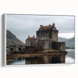Framed canvas artwork depicting a serene landscape featuring a majestic castle surrounded by lush greenery, presented on a white frame for a modern touch. This elegant piece enhances home decor with its vibrant colors and tranquil scene, perfect for art enthusiasts and those seeking to elevate their living space.