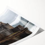 Rolled print of a majestic castle landscape, showcasing vibrant colors and intricate details, designed for home decor enthusiasts seeking elegance and charm.