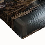 Close-up of a stretched canvas showcasing a vibrant landscape featuring a medieval castle surrounded by lush greenery, perfect for enhancing home decor and art collections.