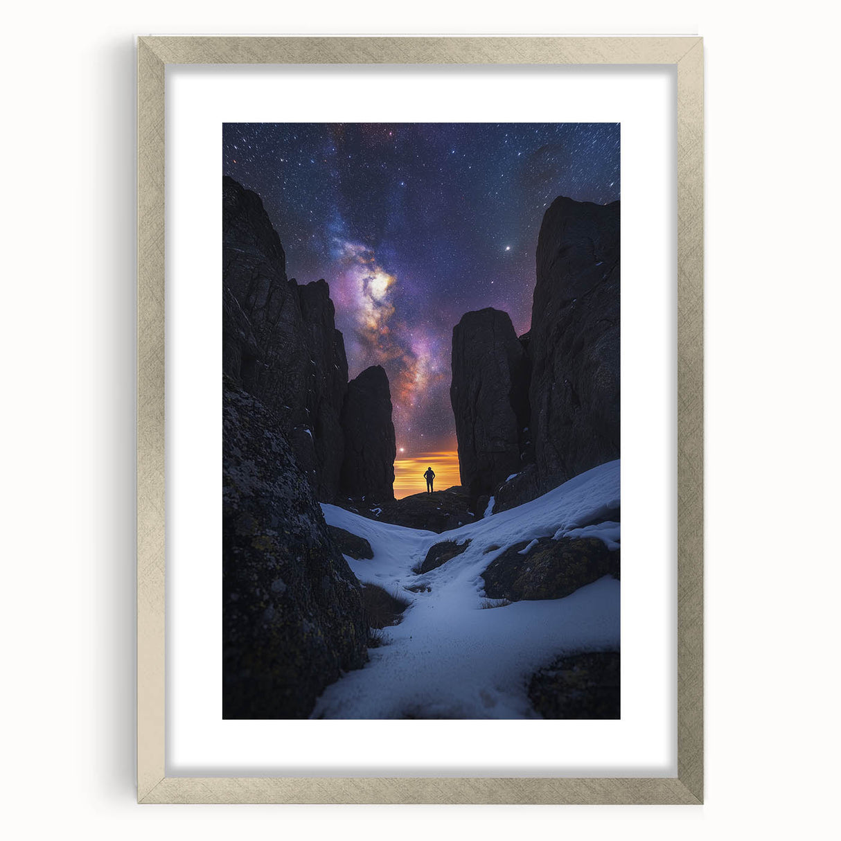 Framed landscape artwork depicting dramatic cliffs, featuring a sleek silver frame and matting, perfect for modern home decor or gallery display.