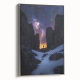 Framed canvas artwork showcasing a dramatic cliff landscape with vibrant colors, enhanced by a sleek silver frame, perfect for modern home decor.