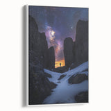 Framed canvas artwork depicting a stunning landscape with dramatic cliffs and a serene sky, showcased in a sleek white frame, ideal for modern home decor.