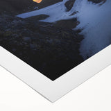 Scenic rolled canvas artwork depicting dramatic cliffs against a vibrant sunset, showcasing rich colors and textures, ideal for home decor.