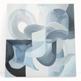 Abstract geometric stretched canvas art showcasing vibrant colors and bold shapes, leaning against a wall, ideal for modern home decor and artistic ambiance.