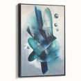 Framed canvas artwork showcasing an abstract design with vibrant splatters on a black background, viewed from the side, perfect for modern home decor.