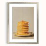 Textured art featuring abstract pastries in muted beige and brown hues, framed with a silver mat.